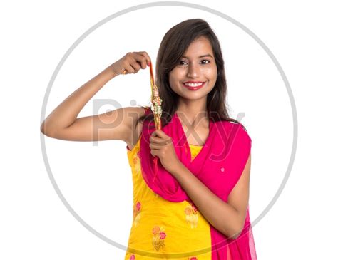 Image Of Beautiful Indian Girl Showing Rakhis On Occasion Of Raksha