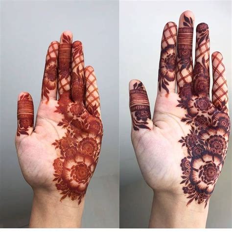 Two Hands With Henna Designs On Them