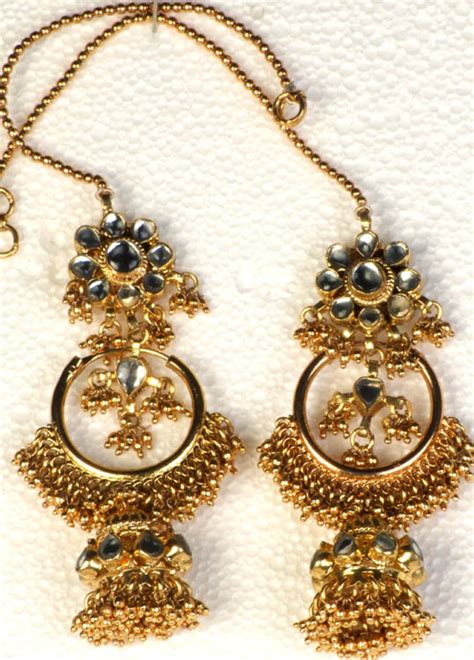 There is a wide range, designs and patterns of imitation. Golden Twin-Design Kundan Earwrap Jhumka Earrings