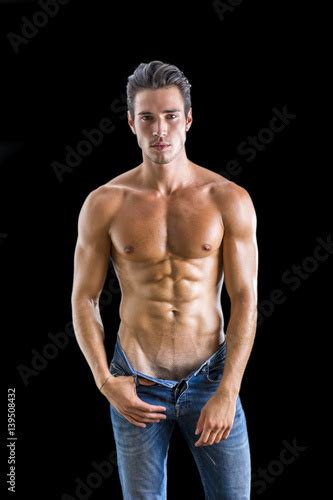 Good Looking Young Gym Fit Man Showing His Sexy Six Pack Abs While