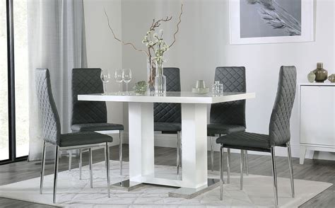 It's crafted from solid poplar wood with white oak and birch veneers in a timeless silhouette with turned legs. Joule White High Gloss Dining Table with 6 Renzo Grey Leather Chairs | Furniture Choice