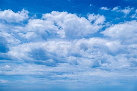 Fluffy Cumulus Cloud On Blue Sky Background Cloudscape White And Grey