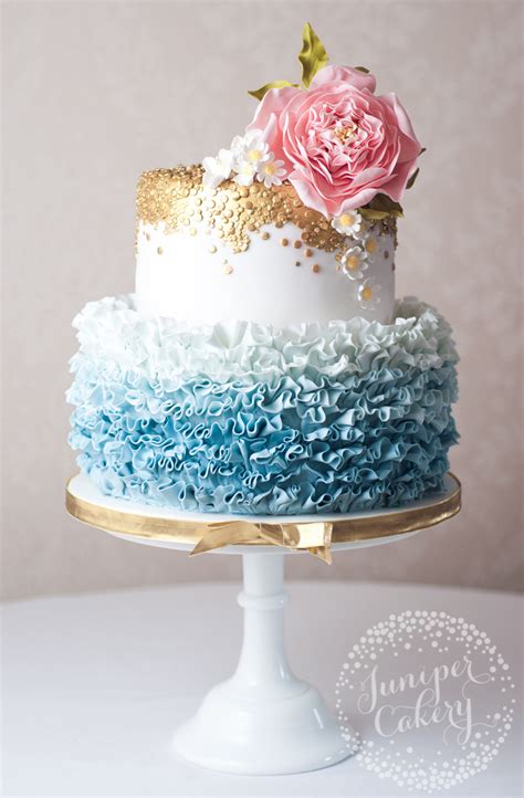 Pretty Blue Ombré Ruffled Wedding Cake With Sugar Daisies