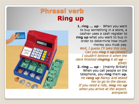 a red and blue toy cash register sitting on top of a table next to money