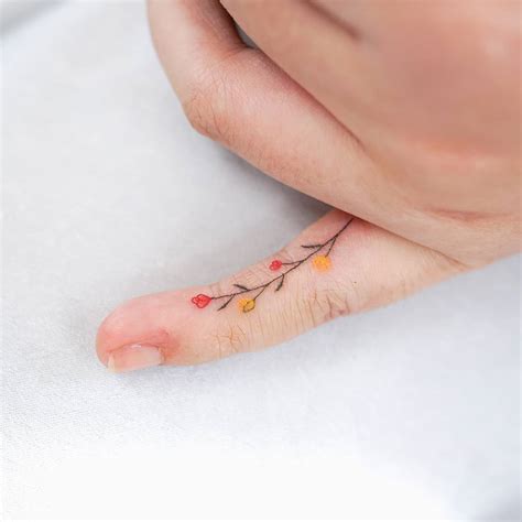 finger tattoos for women 25 classy and unique women s finger tattoos for 2021