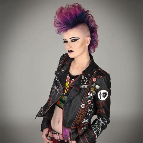 A Woman With Purple Hair Wearing A Black Leather Jacket And Punk Makeup