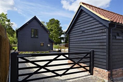 Black Painted Softwood Weatherboarding Designed To Resemble The