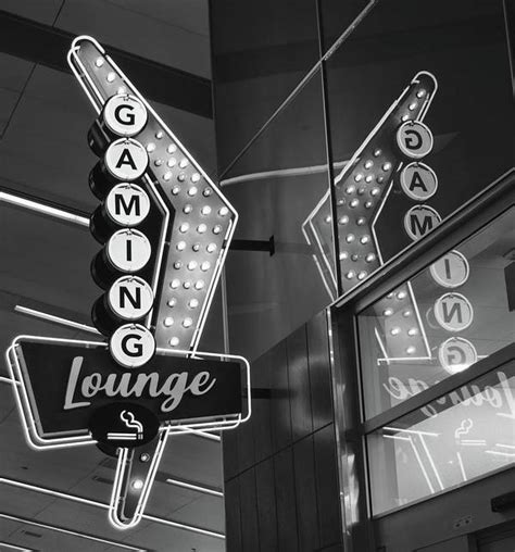 Retro Flying V Neon Gaming Lounge Sign And Reflection Mccarran Airport