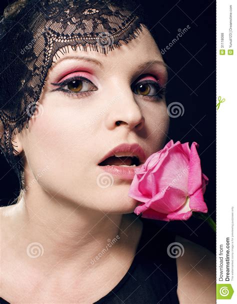 Portrait Of Beauty Blond Woman With Roses In Her Mouth Stock Photo