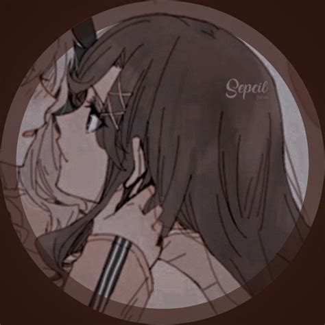 A Couple Kissing Each Other In Front Of A Brown Circle With The Words