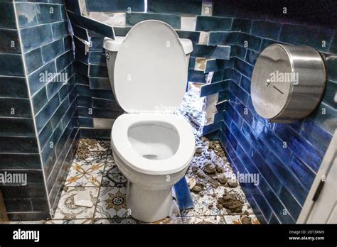 Dirty Unhygienic Toilet Bowl With Broken Wall At Public Restroom Stock