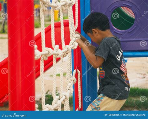 Boy Climbing Rope Ladder In The Playground Stock Photo Image Of Climb
