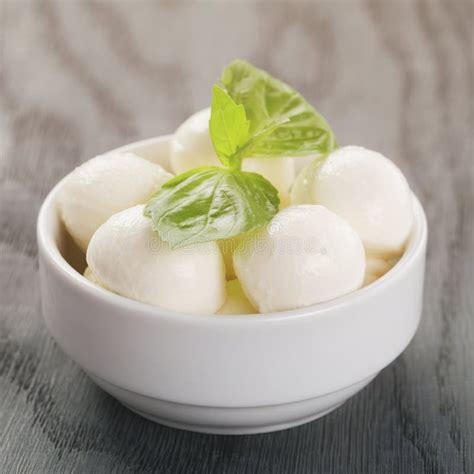Small Balls Of Mozzarella In Bowl With Basil Stock Photo Image Of