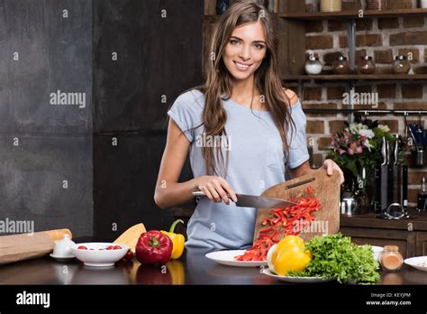Woman Cooking Dinner Stock Photo Alamy