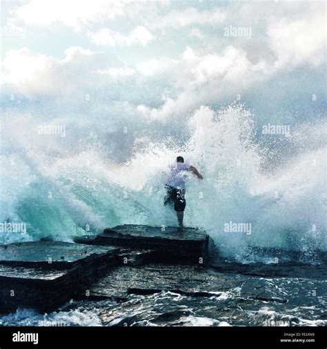 Waves Crashing At Rocks And Man Stock Photo 94721909 Alamy