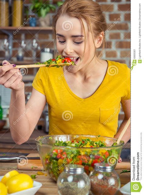 woman tasting vegetable salad stock image image of kitchen gorgeous