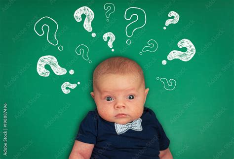 Surprised Thinking Baby With Question Marks On Background Stock Photo