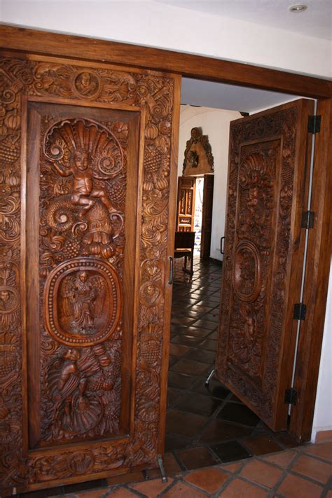 An Ornate Wooden Door Is Open On The Floor
