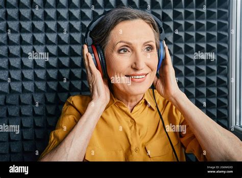 Hearing Test At Senior Woman Positive Mature Woman During Hearing Exam