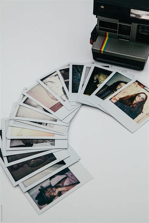 Polaroid Prints Of A Range Of Different People With A Vintage Polaroid