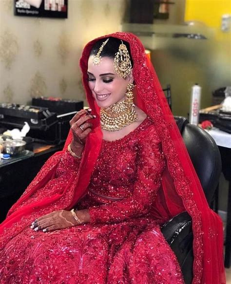 iqra aziz was clad in an all red lengha choli adorned with bead work and sequins for her nikkah