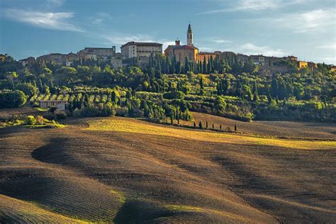 The Charming Village Of Pienza In Tuscany With The Nearby Monastery