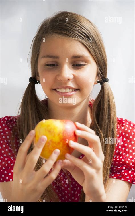 Teenage Girl With Apple Stock Photo Alamy