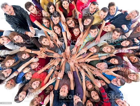 Unity Of Large Group Of Happy People Looking At Camera Stock Photo