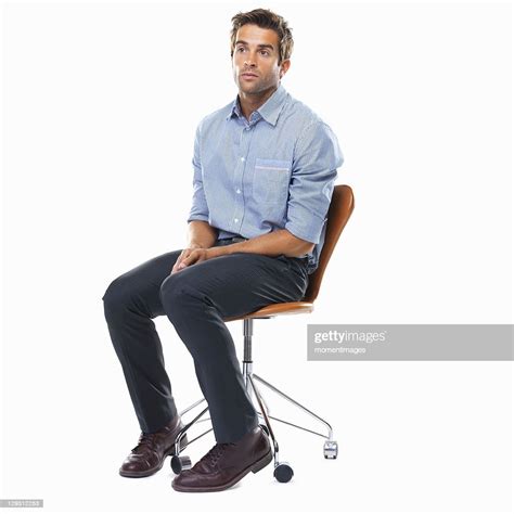 Studio Shot Of Pensive Business Man Sitting On Chair High