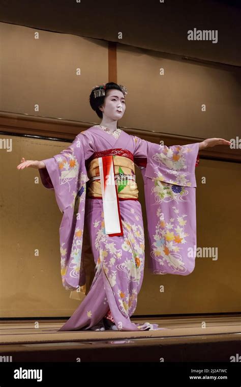 Vertical View Of A Geisha Wearing A Kimono In A Japanese Traditional