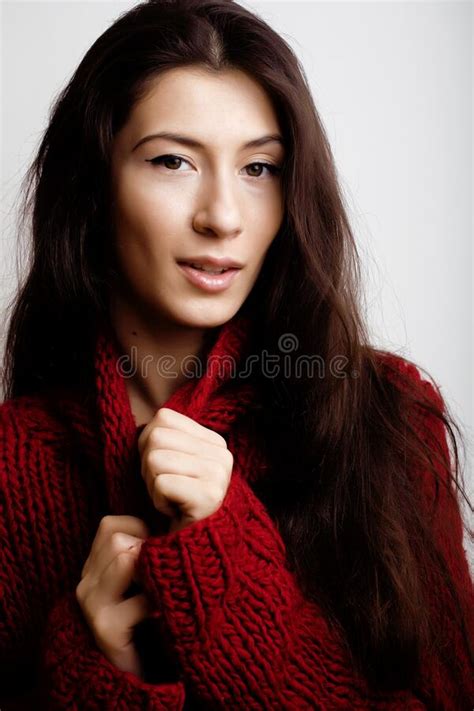 Young Pretty Woman In Sweater And Scarf All Over Her Face Lifes Stock