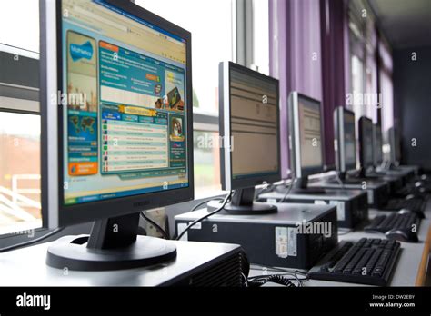 Ict Suite In A Uk Primary School With A Bank Of Desktop Computers Stock