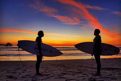 Two Surfers At Sunset In Oceanside