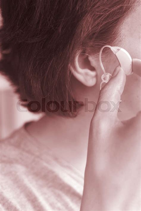 deaf woman hearing aid ear stock image colourbox