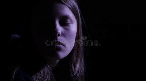 depressed teen girl is crying in the dark 4k uhd stock footage video of depressed face