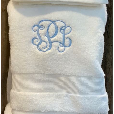 Designed monogrammed kids towels or personalized beach towels covered in their favorite photos. INTERLOCKING MONOGRAMMED BATH TOWEL | Magpies Gifts