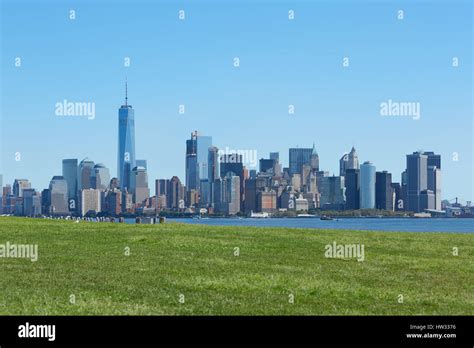 New York City Skyline And Green Meadow Blue Sky In A Sunny Day Stock