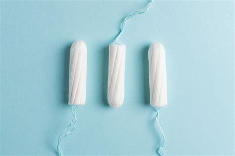 Menstrual Tampon On A Blue Background Menstruation Time Hygiene And