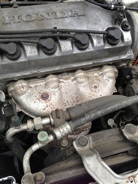 where is the catalytic converter on a honda civic