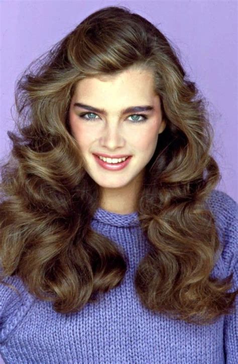 Knitted Blue Jumper Worn By Young Brooke Shields With Long And Wavy Brunette Hair And Subtle