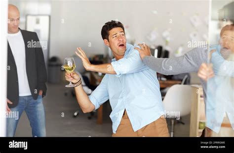 Office Party Gone Wrong A Drunk Man Holding A Glass Of Wine Getting