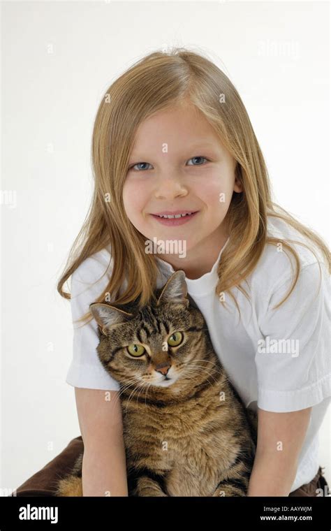 Young Girl Holding Tabby Cat Stock Photo Alamy