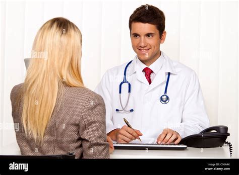 Doctors Interview Patient And Doctor Talking At A Doctors Office