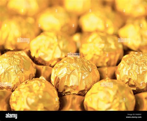 Candy In Gold Wrappers Stock Photo Alamy