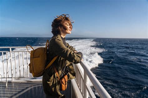 Dreamy Female Standing On Deck In Wind Del Colaborador De Stocksy