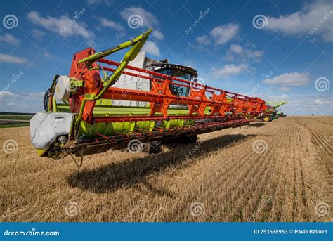 Combine Harvester Close Up In Wheat Field Harvesting Focus On The