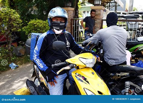 Rider And Delivery Man Of A Motorcycle Courier Service Company