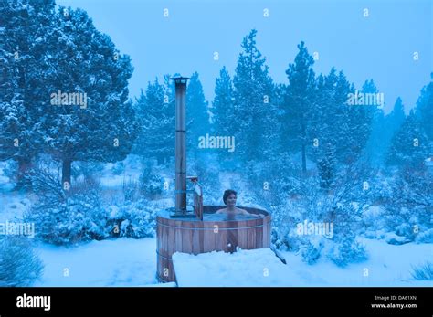 Woman Wood Fired Hot Tub Snow Winter Snowing Central Oregon Usa