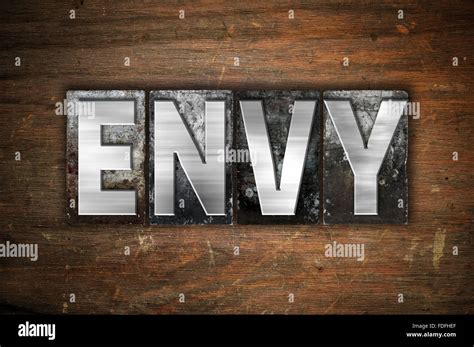 The Word Envy Written In Vintage Metal Letterpress Type On An Aged