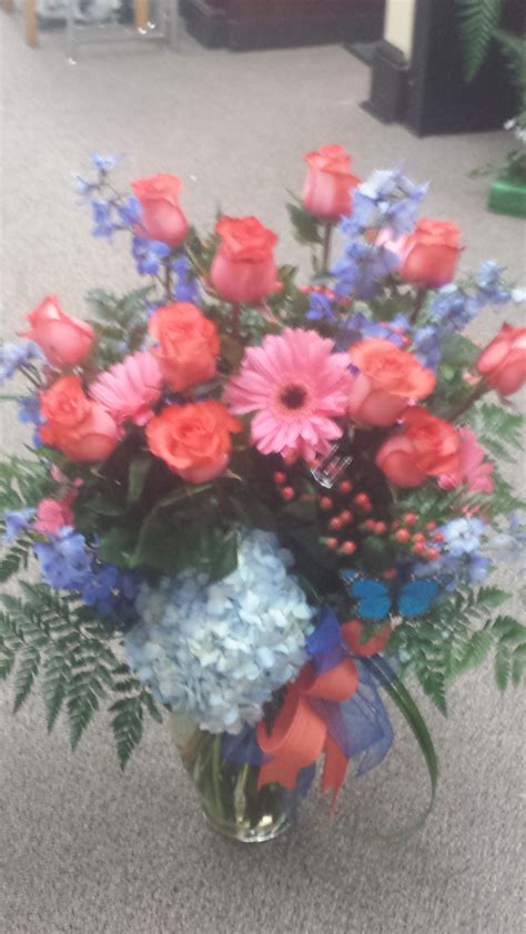 Royal Blue And Coral Arrangement From Gallery Florist And Ts Inc